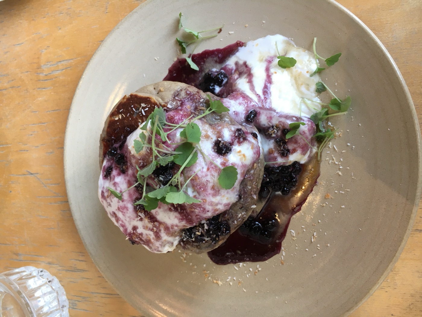 Pancakes with berries, yoghurt and herbs