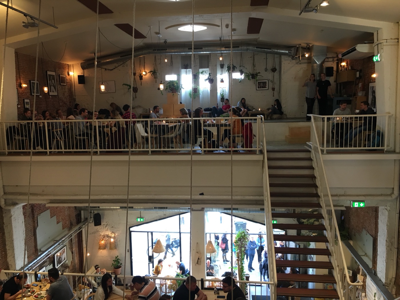 The open staircases and dining levels inside an Amsterdam café