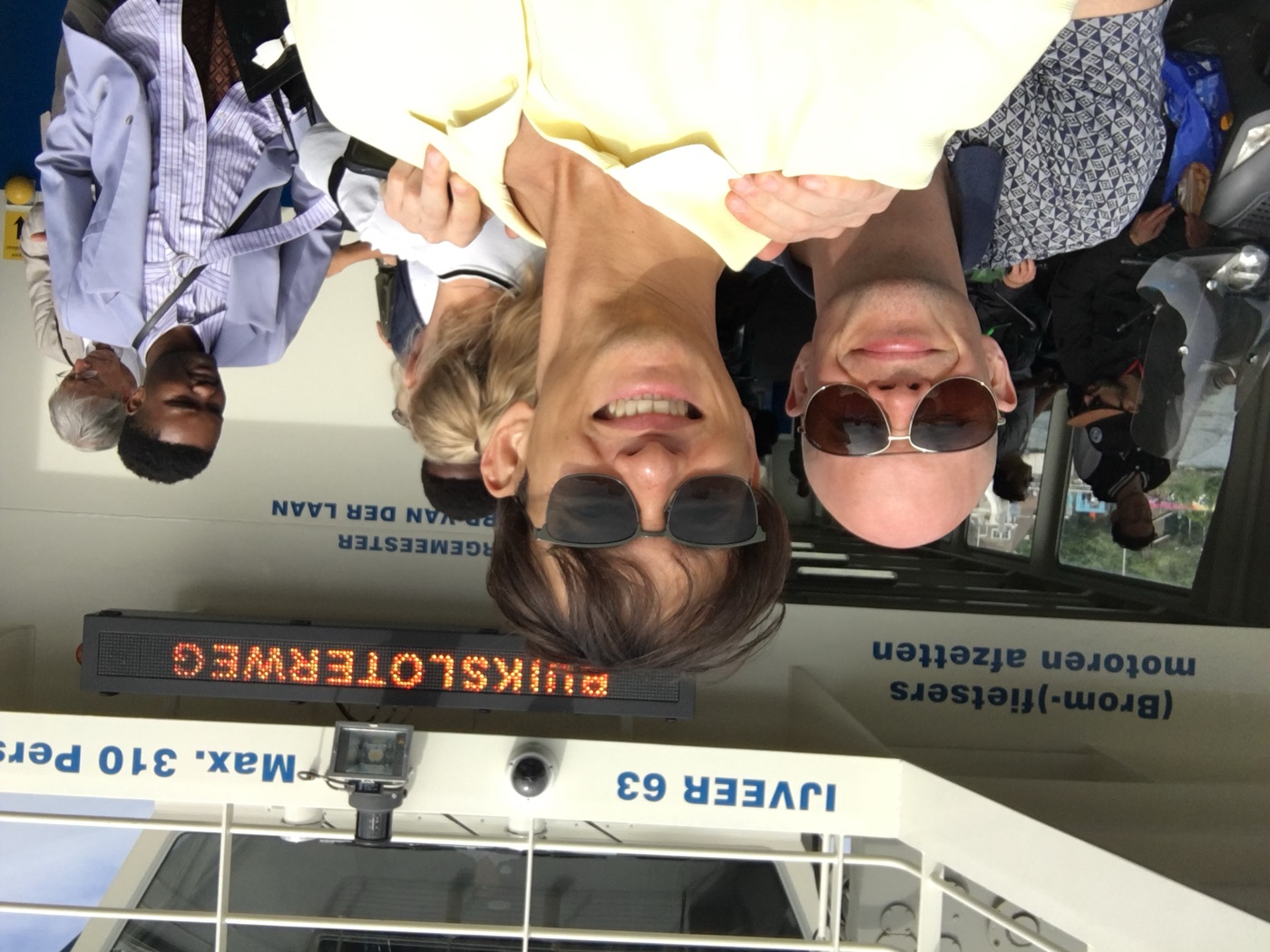 Liam and a friend smiling aboard the Buiksloterweg ferry in Amsterdam
